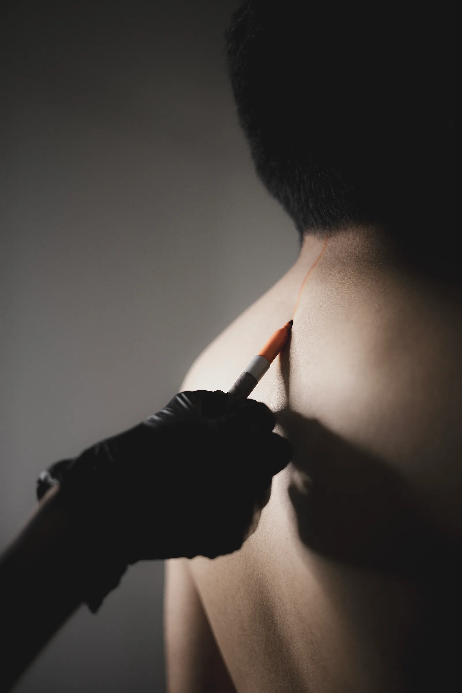 Giselle marking a custom design before tattooing, GAR Tattoo studio
