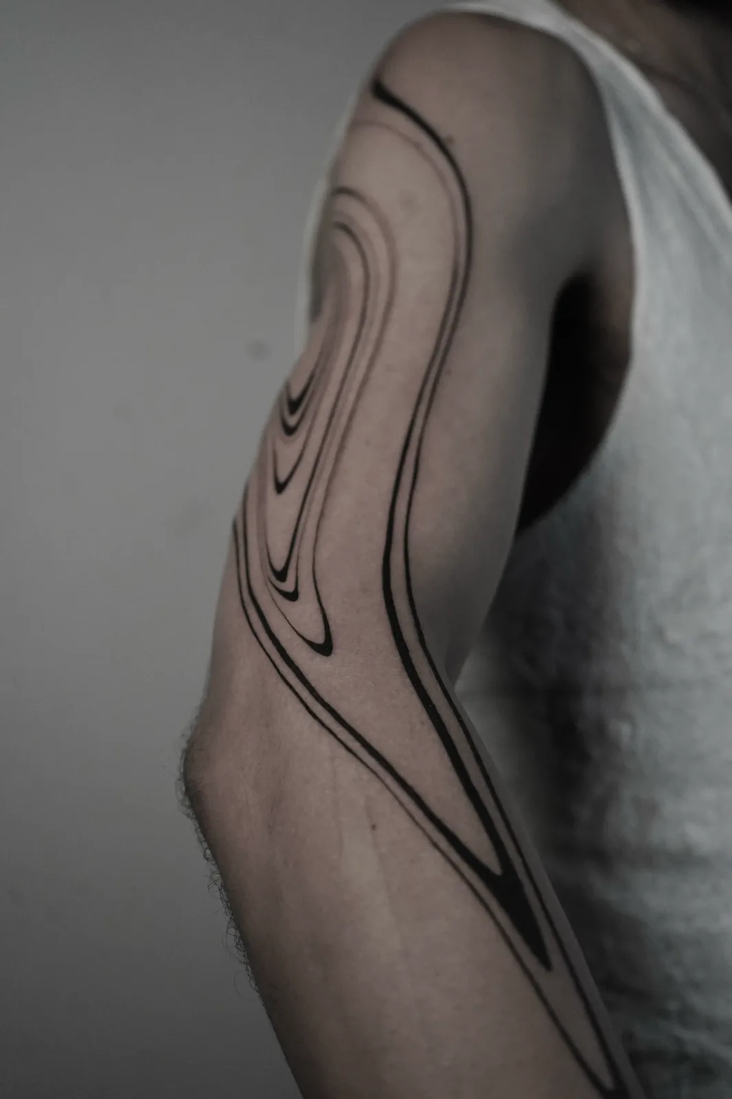 Liquid minimalist blackwork sleeve flowing down the arm by Giselle, GAR Tattoo