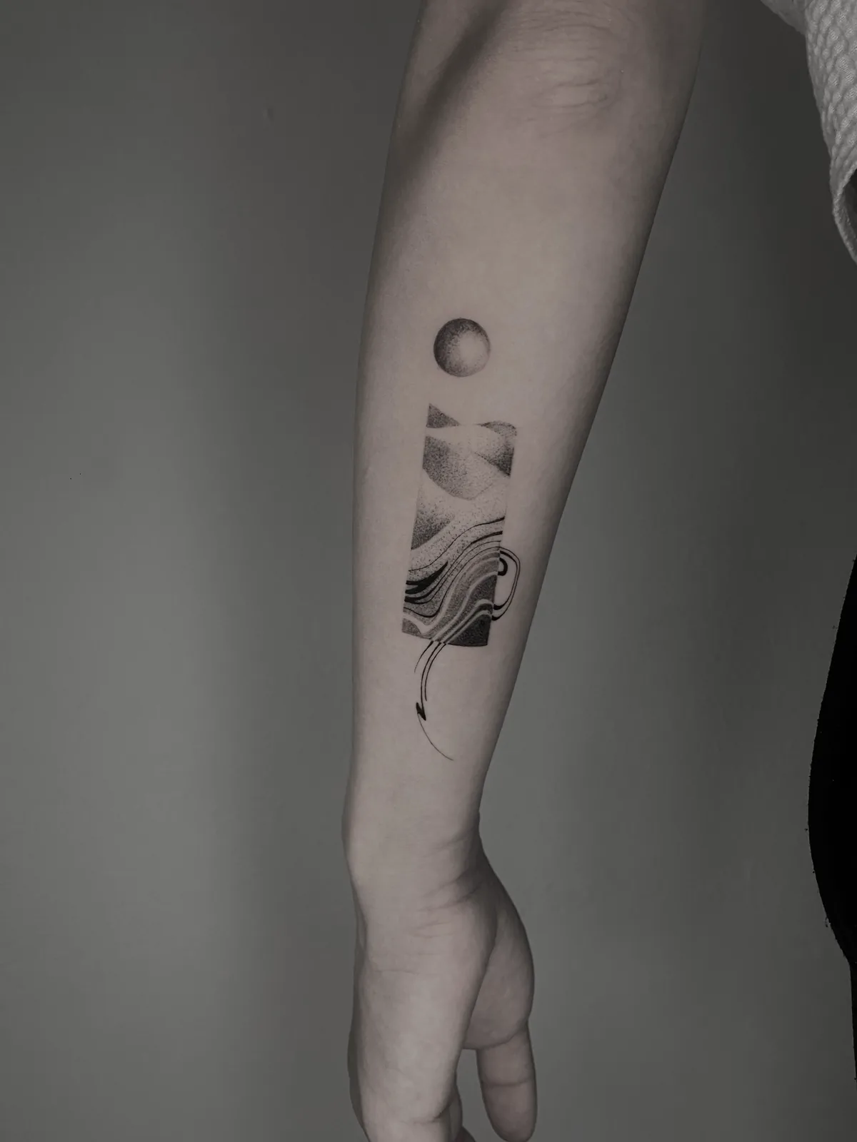 Minimal blackwork abstract shapes on the forearm, GAR Tattoo
